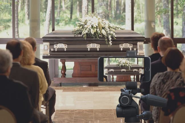 A funeral service being live streamed