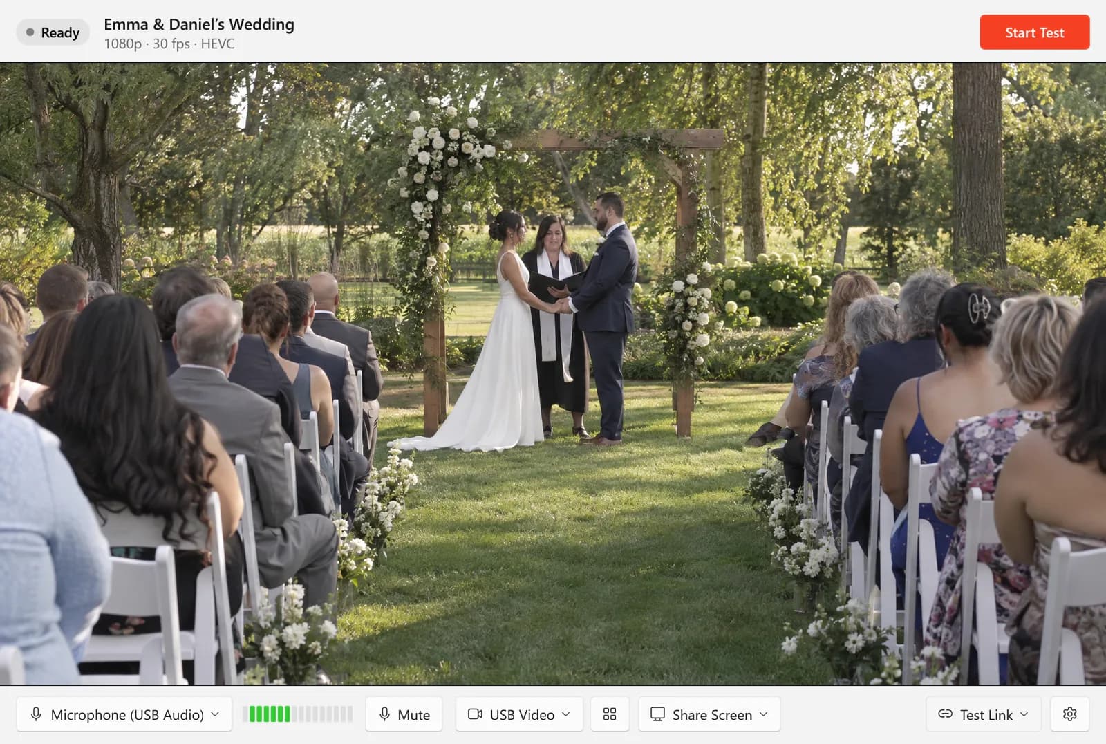 The Studio ready to test a garden wedding, with the camera menu, the grid button that opens the strip, and Share Screen under the picture