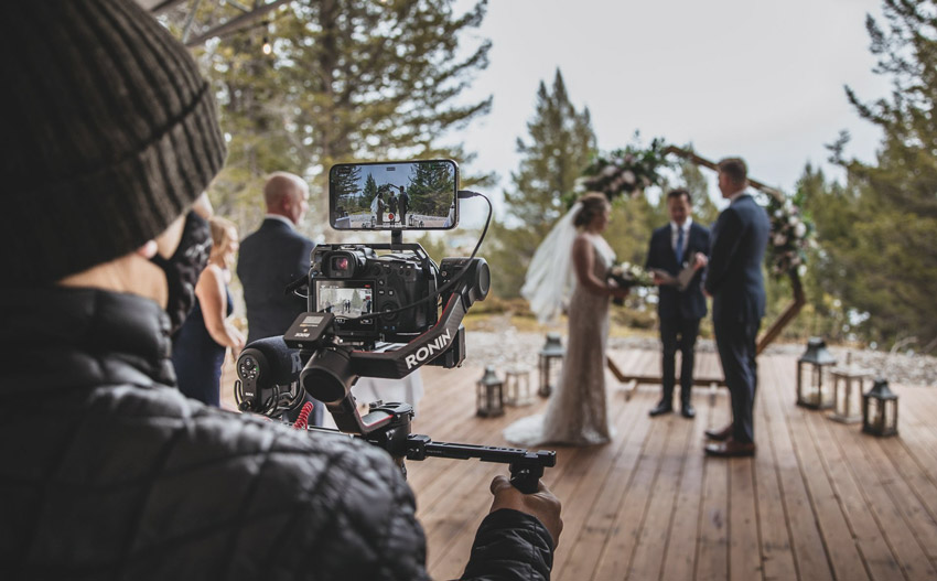 wedding videographer live streaming a ceremony